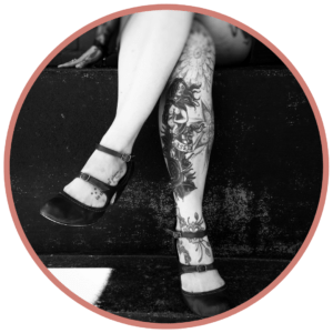 tattooed legs of woman
