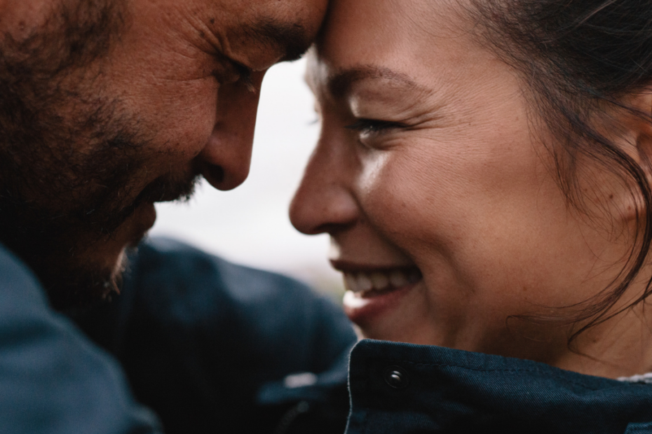couple touching heads and smiling