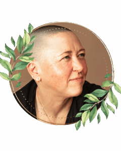 queer person shaved head looking into the distance