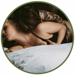 tattooed lovers in bed