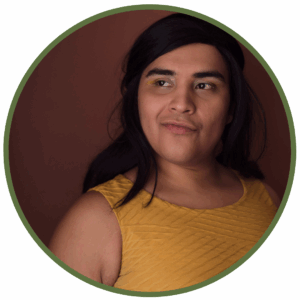 queer person looking thoughtful and hopeful