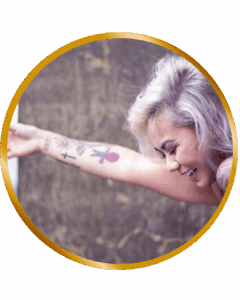 young asian woman with tattoos laughing