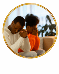 couple sitting on couch struggling with complicated emotions