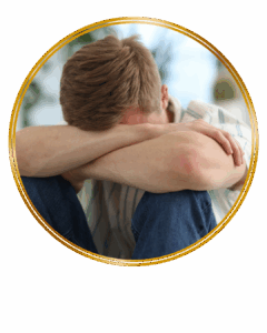 sad man hiding face in arms