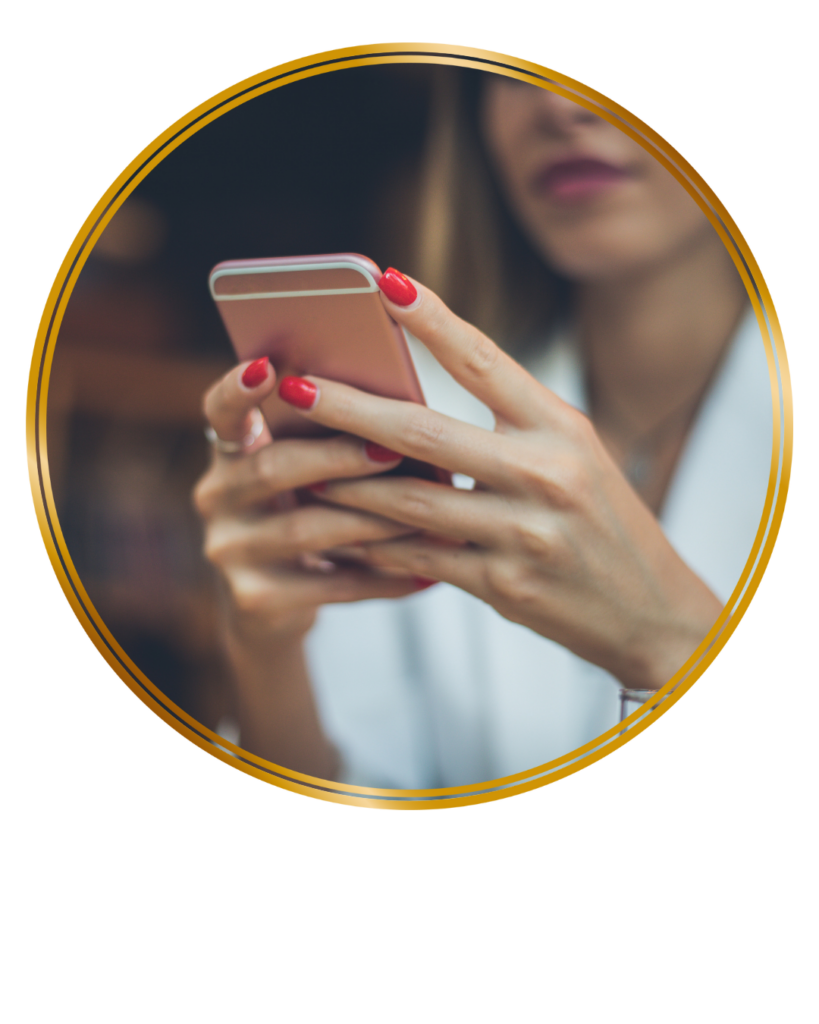 woman with red nails holding cell phone 