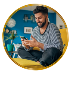 man looking at his phone and smiling