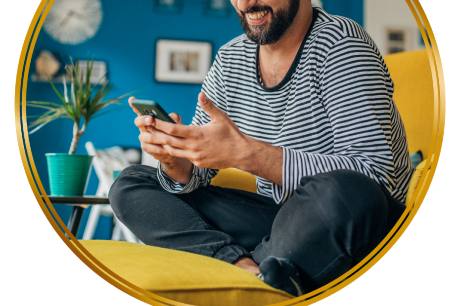 man looking at his phone and smiling