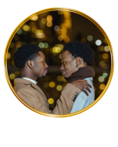 two gay black men looing lovingly at each other