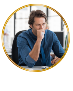 worried man biting his hand looking at computer