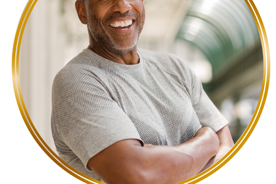 mature man smiling arms folded looking at camera
