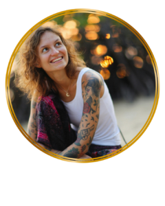 smiling woman with tattoos
