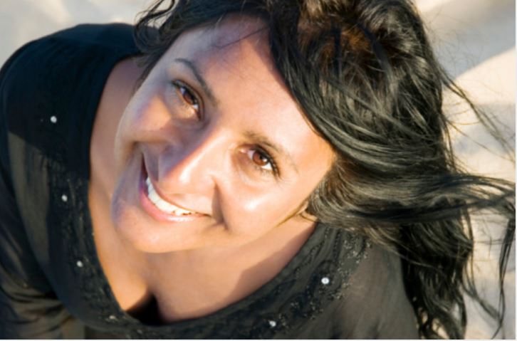 happy woman dark hair brown eyes